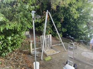 The Contractor uses a tri-pod hoist to lower new panels into the pump station