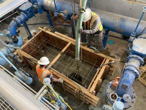 Nearly 8 cubic yards of concrete is used to decommission the existing pump cans and to form new pump…