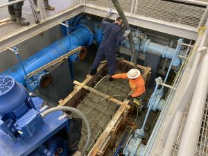 Strider pours the concrete pad for pumps 4 and 5.